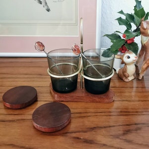 Jam jars on teak tray with brass handle, cruet set with teak, serving set glasses on teak tray