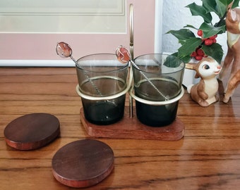 Jam jars on teak tray with brass handle, cruet set with teak, serving set glasses on teak tray