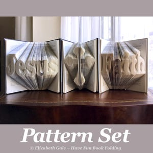 May include: Three open books with folded pages, forming the words "Jesus" and "Faith", and a cross. The books are on a wooden surface. The text "Pattern Set" is at the bottom of the image.