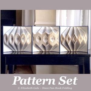May include: A triptych of folded book art pieces, each framed in black. The book pages are intricately folded to create geometric patterns. The text "Pattern Set" is displayed at the bottom of the image.