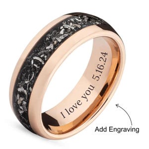 May include: Rose gold band with a black and silver meteorite inlay. The inside of the band is engraved with "I love you 5.16.24".