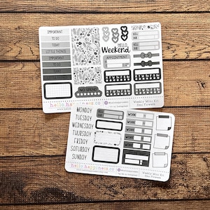 May include: Two sheets of planner stickers with a black and white floral theme. The stickers include labels like "Important," "To Do," and "Weekend," along with decorative elements and a grid. The text "hello.happiness.co" is visible.