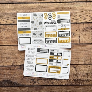 May include: Two sheets of planner stickers with a graduation theme. The stickers include labels like "Important," "To Do," and "Today," along with graduation caps and stars. The color scheme is gold, gray, and white.