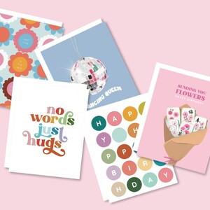 May include: A collection of five greeting cards featuring various designs: a floral pattern with text, a disco ball with the text DANCING QUEEN, a white card with the text no words just hugs, a card with colorful circles spelling HAPPY BIRTHDAY, and a pink card with a bouquet of mahjong tiles and the text SENDING YOU FLOWERS HAPPY BIRTHDAY.