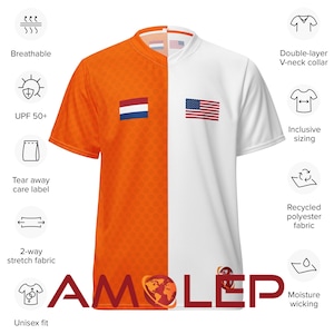 May include: Orange and white short-sleeved shirt with a V-neck collar. The shirt is split down the middle, with the left side featuring the Dutch flag and the right side featuring the American flag. The shirt has the text "AMOLEP" printed on the bottom.