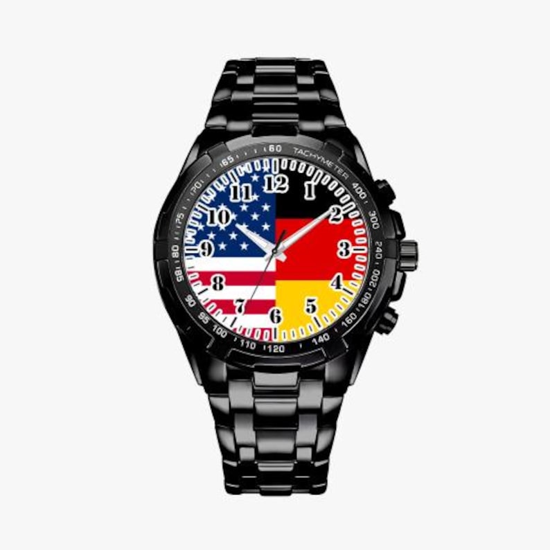 May include: A black wristwatch with a stainless steel band. The watch face features a design of the American and German flags.
