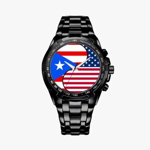 May include: Black wristwatch with a black band and a white face. The face features a split design with the flags of Puerto Rico and the United States.