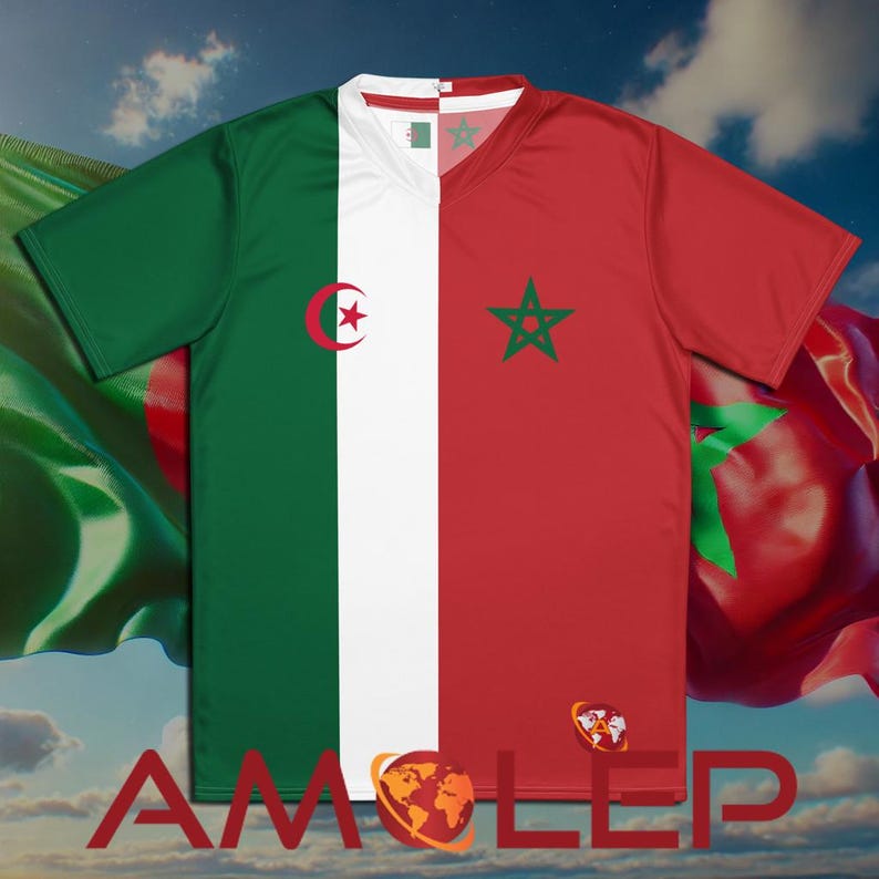 May include: A white t-shirt with a green, white, and red design. The design features the flags of Algeria and Morocco, with a crescent moon and star on the left side and a five-pointed star on the right side.