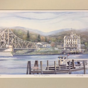 May include: A watercolor painting of a bridge over a river with a white building on the right side of the image. The bridge is made of wood and metal and has a brown and gray color. The building is a large, white structure with a brown roof and many windows. The river is blue and calm. The painting is signed by the artist, "J. Clark", in the lower right corner. The text "View of East Haddam" is written in the lower center of the image.