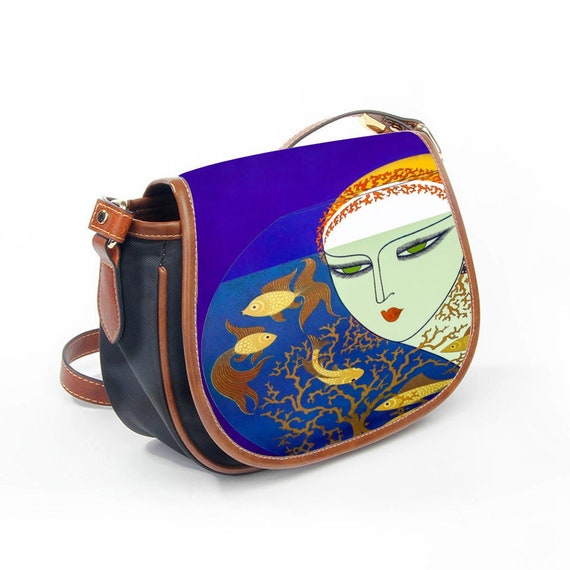 Small graceful elegant art deco shoulder bag inspired by the aristocratic genius Erte. Beauty woman, gold fish aquarium on purple background