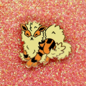May include: A yellow and orange cartoon character with a fluffy tail and black stripes. The character is a Pokemon named Flareon.