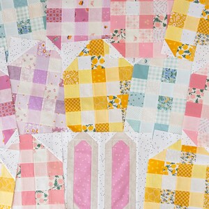 A colorful quilt block arrangement featuring pink and beige bunny ears at the center, surrounded by patchwork in pastel shades and floral patterns, creating a playful and cheerful tone.