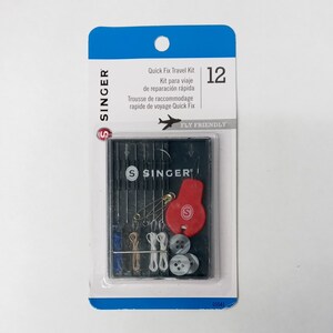 May include: A Singer Quick Fix Travel Kit in a blue and white package. The kit includes needles, thread, buttons, a safety pin, and a threader. The package says "Quick Fix Travel Kit" and "Fly Friendly".