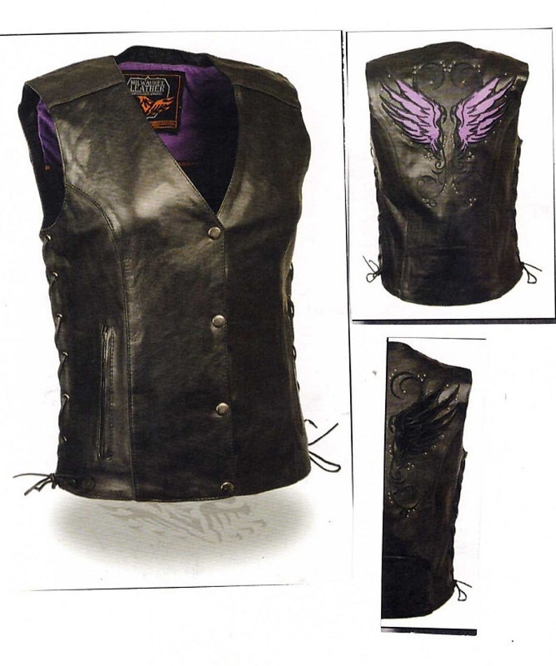 May include: Black leather vest with a lace-up side and a purple winged design on the back. The vest has a zip fastening and multiple pockets.