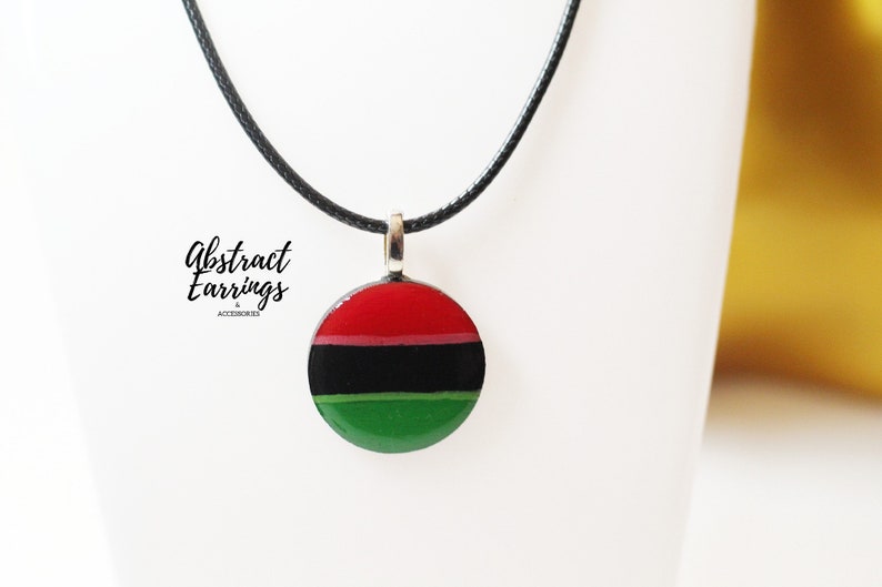 Pan African Flag Pendant Necklace - Unisex Afrocentric Charm -  Wooden Resin Art Charm - Gift for Him Her - Juneteenth Celebration Fashion by Abstract Earrings & Accessories