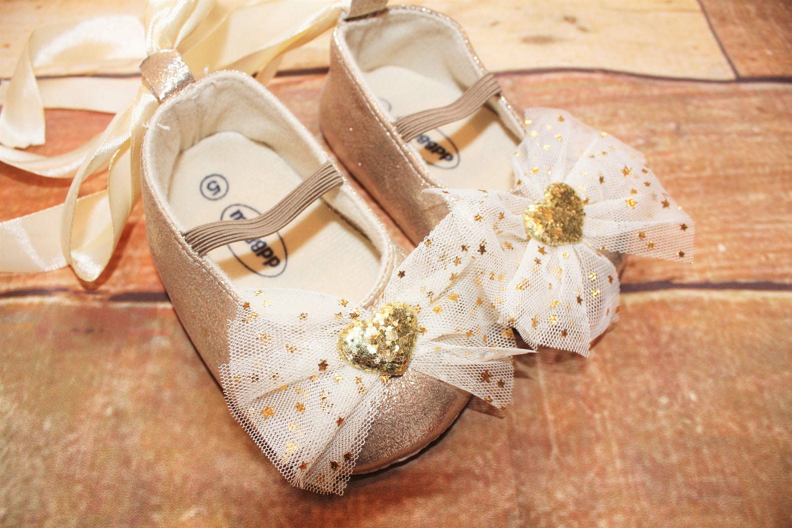 baby girls gold shoes, sparkly, glittery, ballet style, ribbon tie & hearts decoration, cake smash