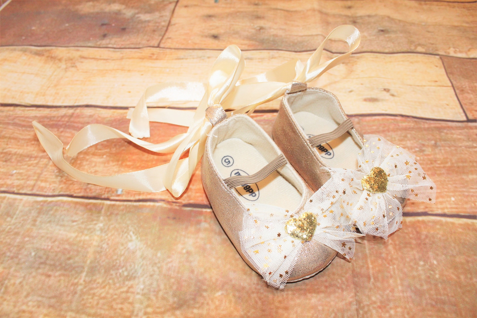 baby girls gold shoes, sparkly, glittery, ballet style, ribbon tie & hearts decoration, cake smash