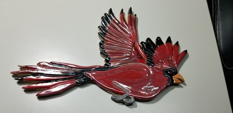 Ceramic cardinal for mosaics.