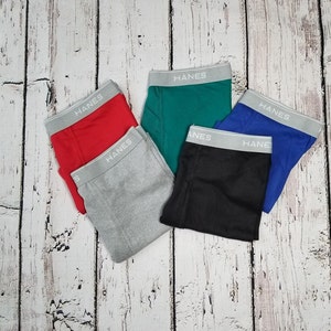 Color options for boxer briefs. Black, grey, blue, red, and green.