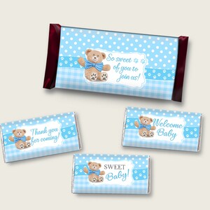May include: Blue and white polka dot and gingham patterned chocolate bar wrappers with a teddy bear wearing a blue bow tie. The wrappers have the text "So sweet of you to join us!" "Thank you for coming!" "Welcome Baby" and "Sweet Baby!"