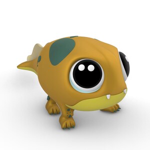 Pu&ograve; includere: Una piccola creatura giocattolo di stile cartone animato, arancione e verde, con grandi occhi neri e un ghigno pieno di denti.