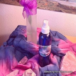 8 ounce Sacred Space Spray infused with Essential Oils of Sage, Hyssop and Geranium. Blue plastic bottle with aerosol pump sprayer. Use for meditation or general aura clearing. Keep one by the front door for use when entering the house.