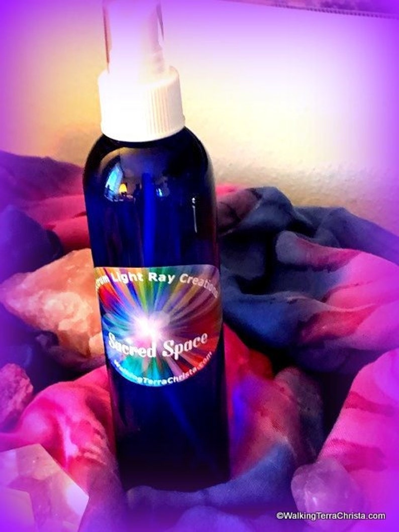 8 ounce Sacred Space Spray infused with Essential Oils of Sage, Hyssop and Geranium. Blue plastic bottle with aerosol pump sprayer. Use for meditation or general aura clearing. Keep one by the front door for use when entering the house.