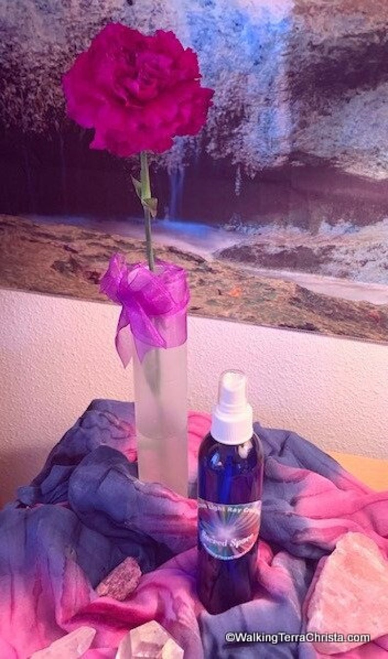 8 ounce Sacred Space Spray infused with Essential Oils of Sage, Hyssop and Geranium. Blue plastic bottle with aerosol pump sprayer. Use for meditation or general aura clearing. Keep one by the front door for use when entering the house.