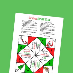 May include: A red, green, and white Christmas fortune teller with a Santa Claus, a Christmas tree, an elf, and a candy cane. The fortune teller has questions and answers related to Christmas.