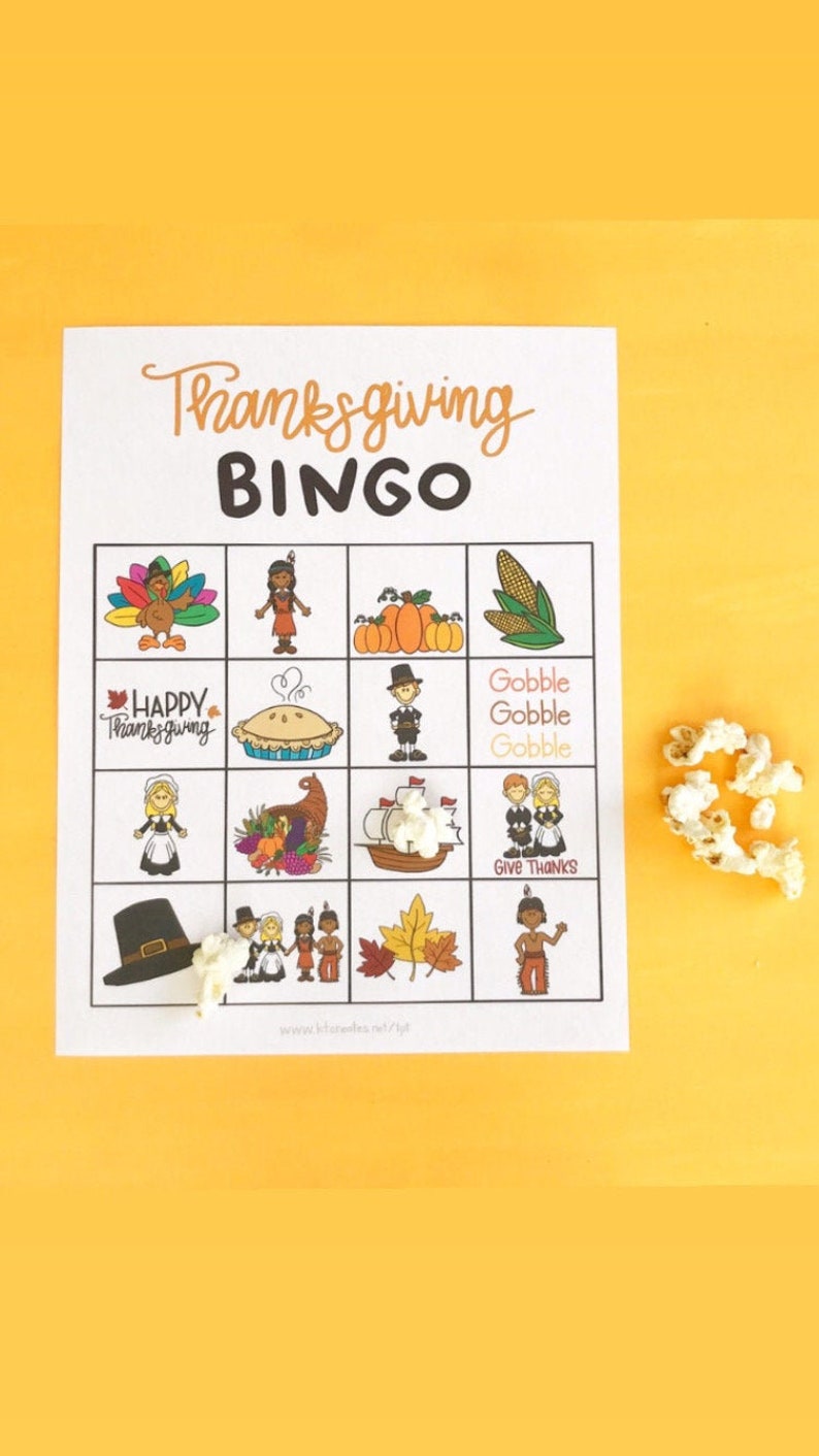 May include: A Thanksgiving Bingo card with images of a turkey, pilgrims, corn, pumpkins, a pie, a ship, a hat, and fall leaves. The text on the card says "Thanksgiving Bingo" and "Gobble Gobble Gobble".