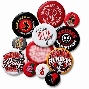 May include: A collection of circular pin-back buttons featuring various designs, including text like 'Duck Walk Diva', 'Crimson and Cream', 'Oh to be a Delta Girl', 'Excuses are tools of the incompetent', 'Work Pray G.P.A.', and 'Yard Runners' with elephant graphics.
