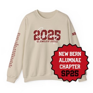 May include: A cream-colored sweatshirt with maroon lettering and graphics. The front features "2025 Spring" and "20 Jewels of Justice." The left sleeve has a list of names. A red and black starburst graphic reads "New Bern Alumnae Chapter SP25."