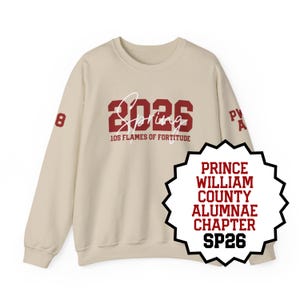 May include: A beige crewneck sweatshirt featuring dark red block lettering that reads 2026 with the word Spring in white script overlay. Below, 10S FLAMES OF FORTITUDE is printed in red. The number 8 appears on the right sleeve and PW A on the left.