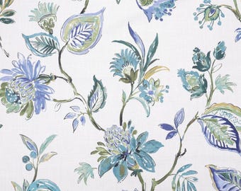 May include: A white fabric featuring a repeating botanical pattern of stylized flowers and leaves in shades of blue, teal, and sage green. The design includes intricate floral blooms and elongated foliage connected by thin, dark stems.