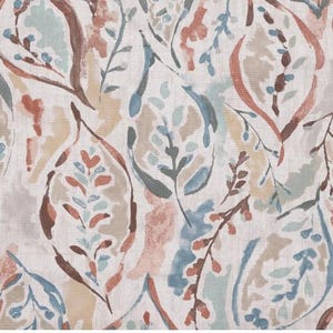 May include: A fabric with a repeating pattern of stylized leaves and branches in shades of brown, blue, and beige. The design has a watercolor effect, with soft edges and a textured appearance. The background is a light cream color.