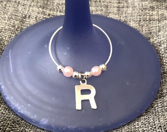 Personalised wine charms with a silver initial and your chosen colour decorative beads.