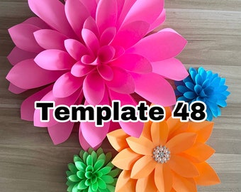 May include: A set of four paper flowers in various colors, including pink, orange, green, and blue. The flowers are layered and have a 3D effect. The largest flower is pink and has a center that is slightly darker than the petals. The orange flower has a pearl-like embellishment in the center. The text "Template 48" is visible in the center of the image.
