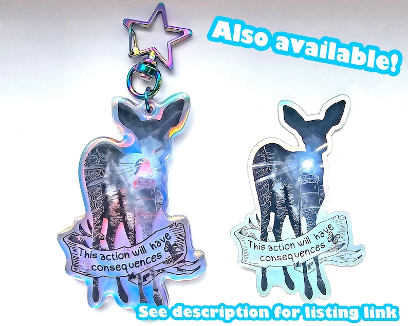 May include: Two iridescent holographic keychains featuring a silhouette of a deer with the text "This action will have consequences" on a banner.