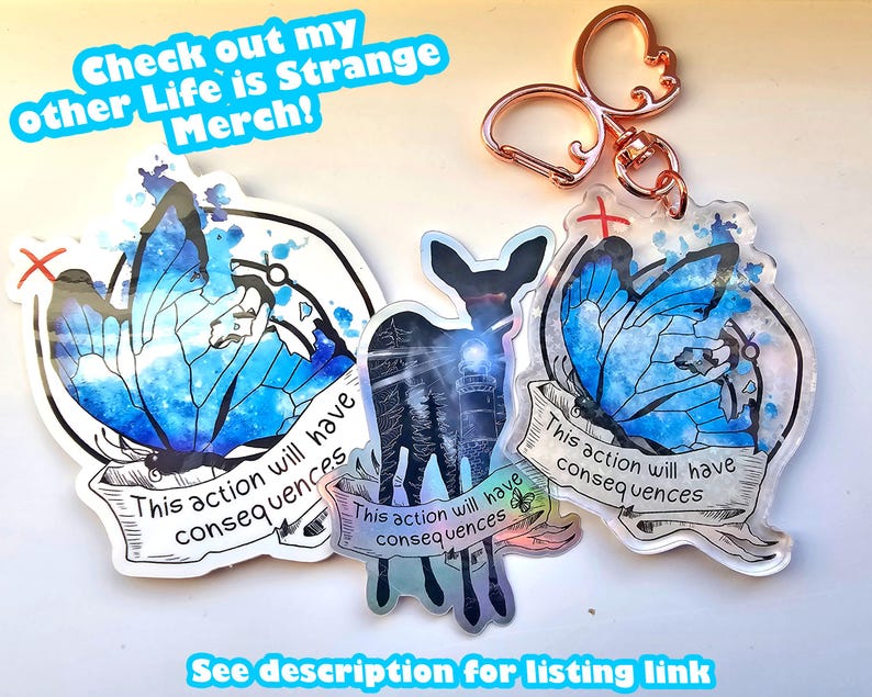 May include: Three iridescent acrylic keychains featuring a butterfly design with the text "This action will have consequences". The keychains are attached to a gold-coloured metal ring.