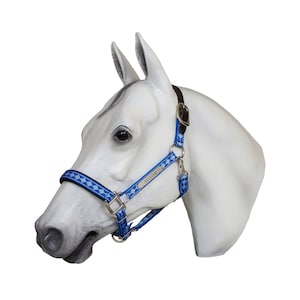 May include: Blue and white patterned horse halter with a silver nameplate that reads "ALLSTAR".