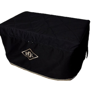 May include: Black quilted storage bag with a gold embroidered logo that says "RDL".