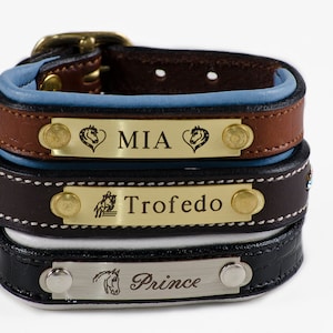 May include: Three leather bracelets with engraved metal plates. The top bracelet is brown with a blue lining and says "MIA" with a horse head design on each side. The middle bracelet is brown with rhinestones and says "Trofedo" with a horse jumping over a hurdle. The bottom bracelet is black with a silver plate that says "Prince" with a horse head design.