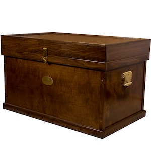 May include: A dark brown wooden storage chest with brass hardware and a brass nameplate that says "Alice".