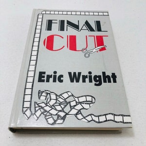 May include: A gray hardcover book with the title "FINAL CUT" in black and red lettering. The title is surrounded by a film strip border. The author's name, "Eric Wright", is printed in black below the title. A pair of scissors is shown cutting a film strip.