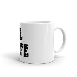 May include: White ceramic coffee mug with a black graphic that says "Full Life" in a bold, blocky font.