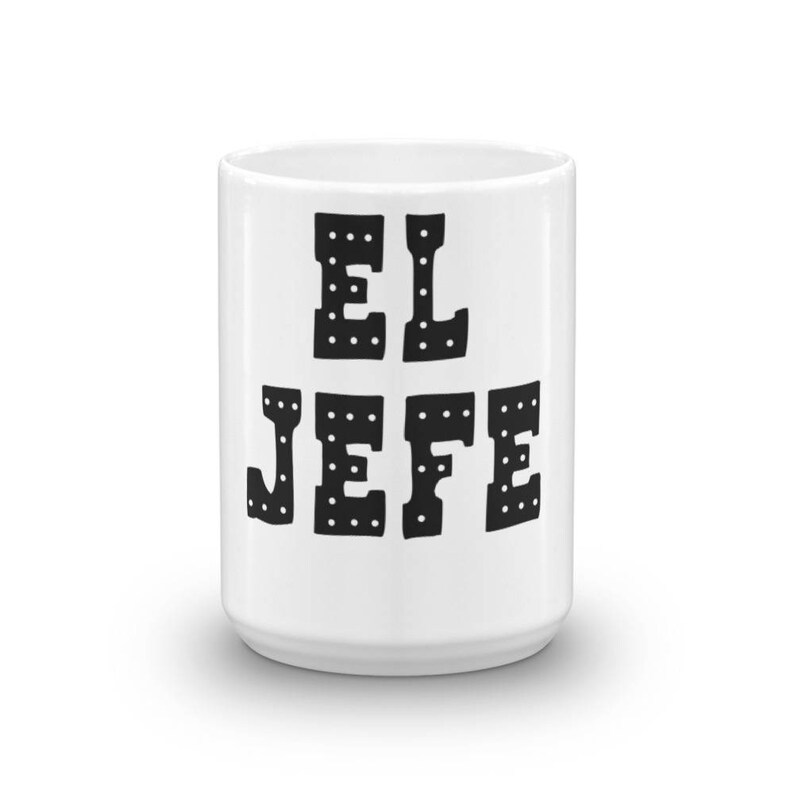 May include: White ceramic mug with black text that reads "EL JEFE" in a bold, blocky font with white dots around the letters.