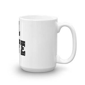 May include: White ceramic coffee mug with black text that reads "I love coffee" in a blocky font.