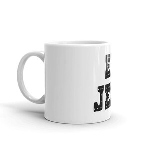 May include: White ceramic coffee mug with a black graphic that says "Eat, Sleep, Jeeps, Repeat".