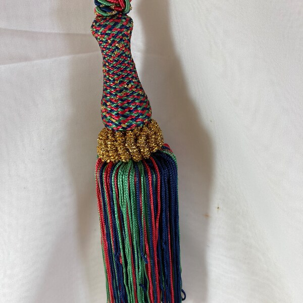 12" x 2" sparkling tassel in red black green w/ gold trim