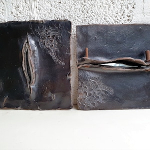 Two Black Ceramic Wall Sculptures